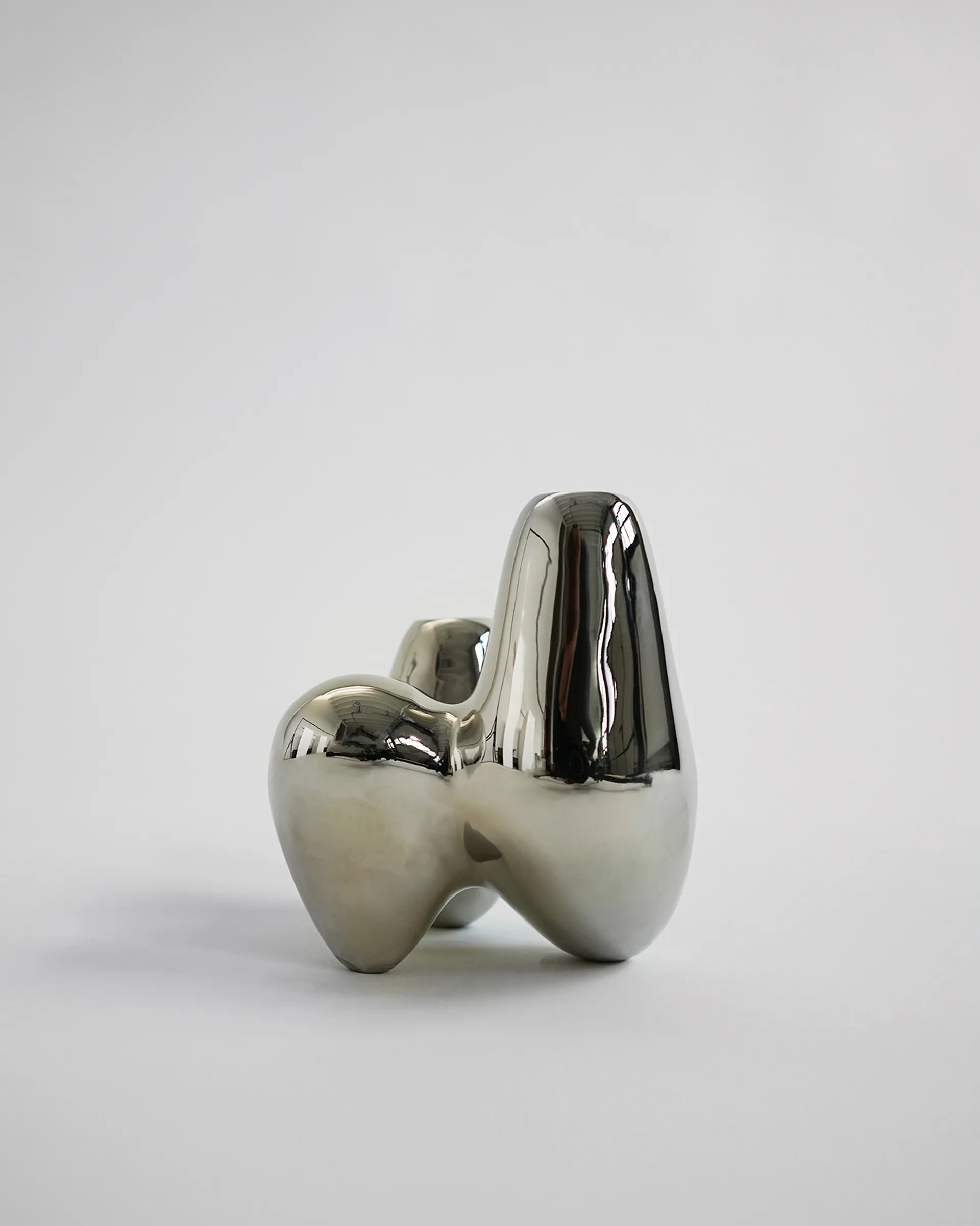 Unity kandelaar, Chrome Hein Studio