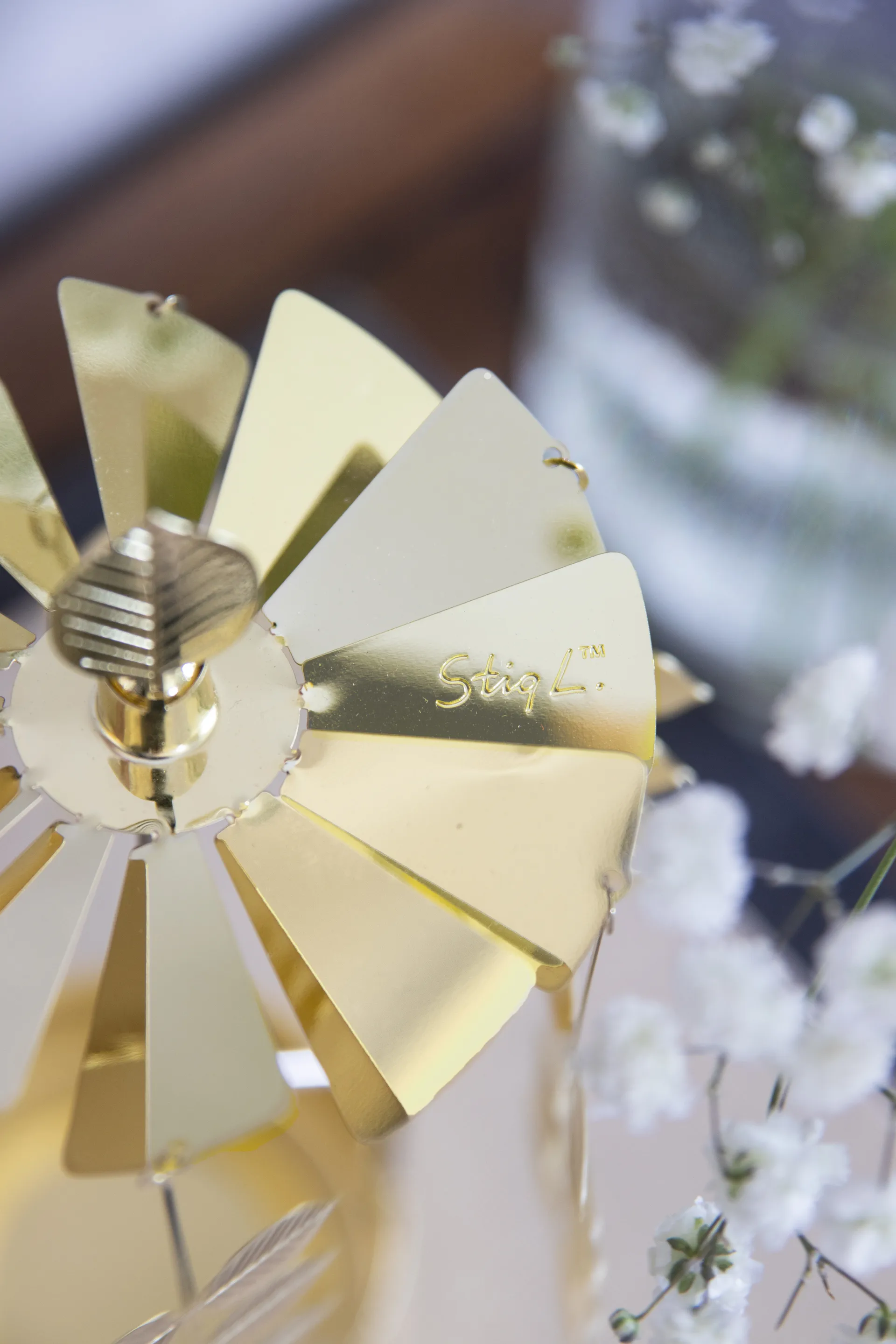 Stig L Berså draaiende waxinelichtjeshouder medium, Goud Pluto Design