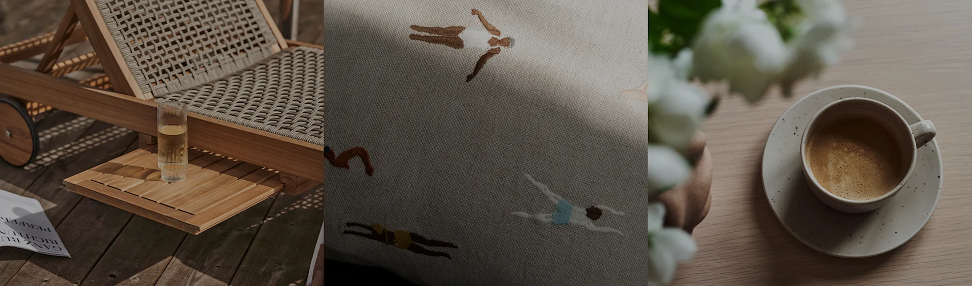 Een ligstoel met een drankje, een geborduurd kussen met zwemmers en een koffiekopje met witte bloemen.