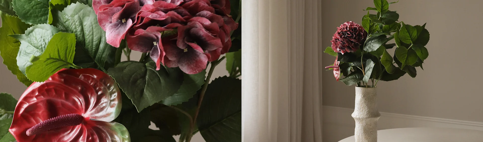 Kunstmatige donkerrode hortensia en rode anthuriumbloemen in een getextureerde witte vaas.